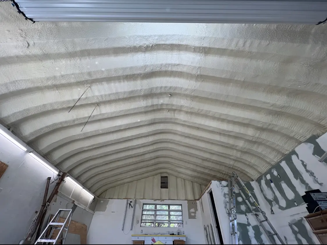 Spray polyurethane foam applied to the underside of a metal roof deck in Sarasota